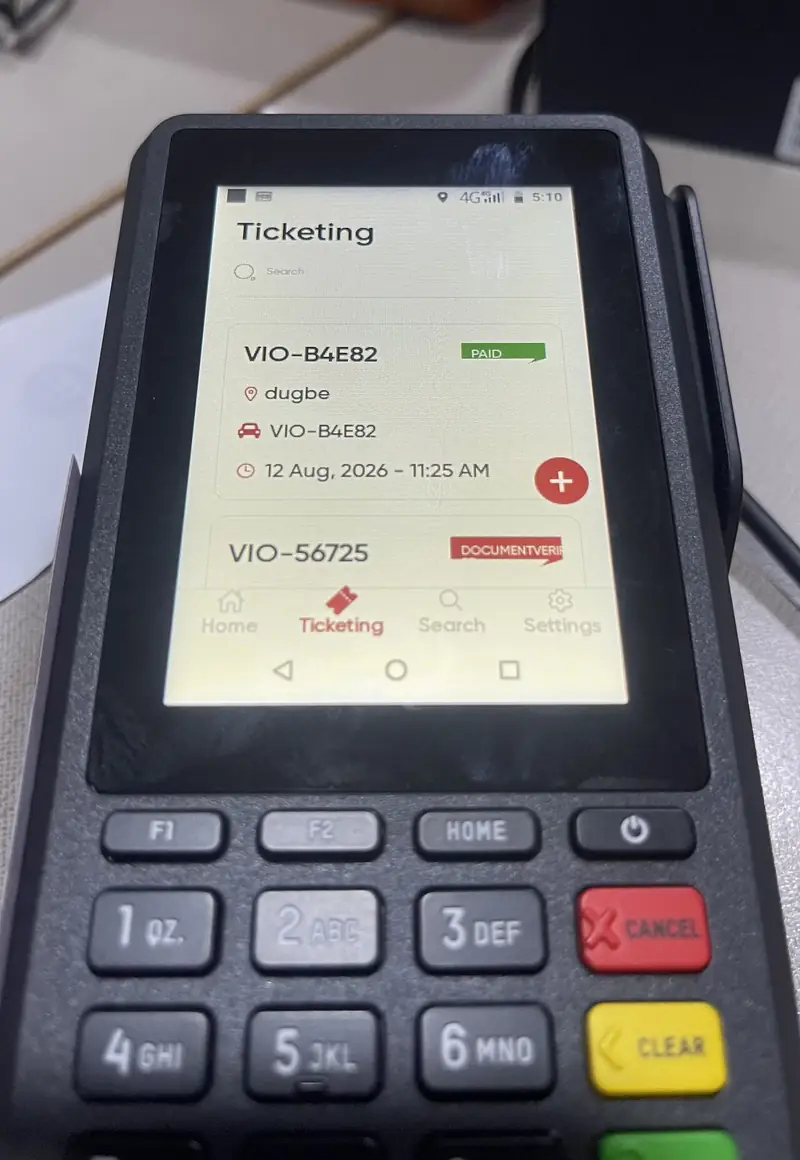 The OYO-VIO Ticketing screen on a POS terminal, listing a paid ticket and one awaiting document verification.